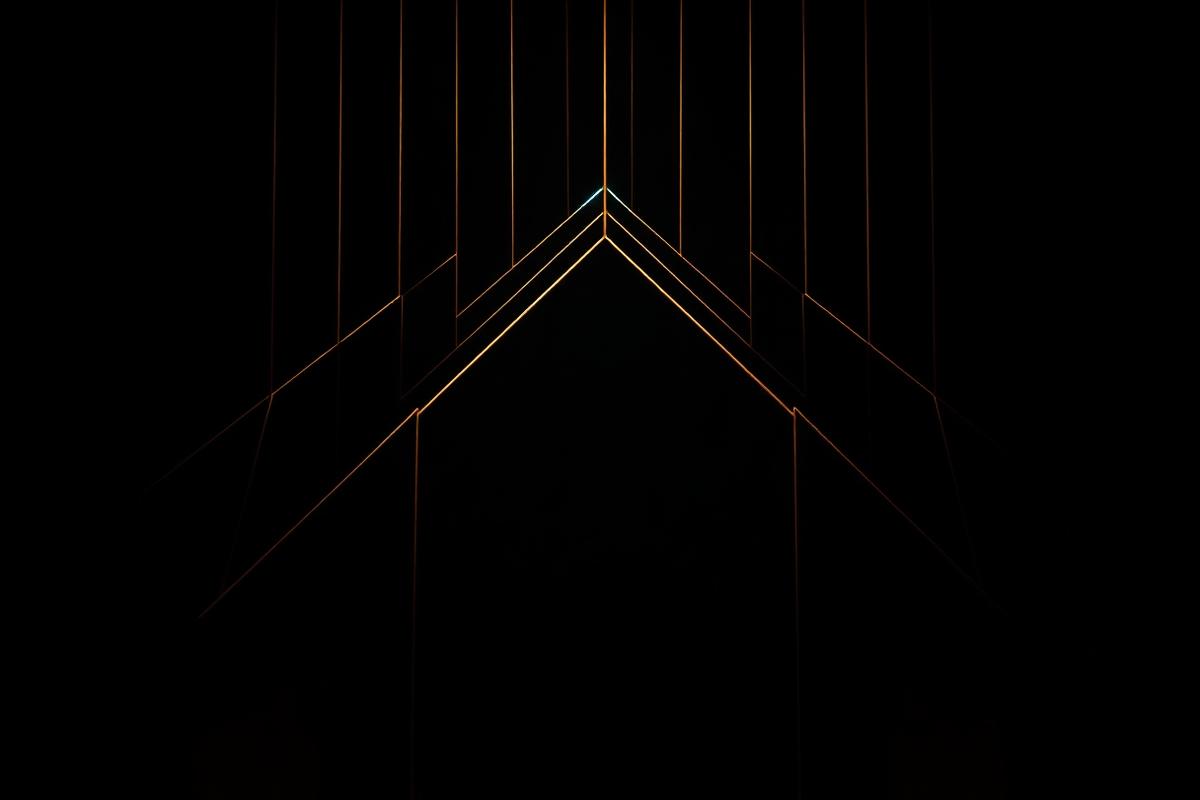 Abstract dark geometric composition of thin illuminated lines